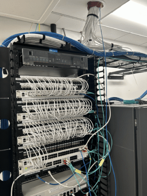 Rack-mounted network patch panels, and cables.