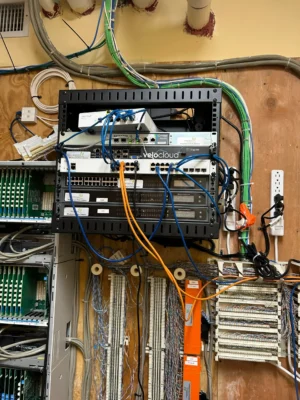Network rack with colorful patch cables.